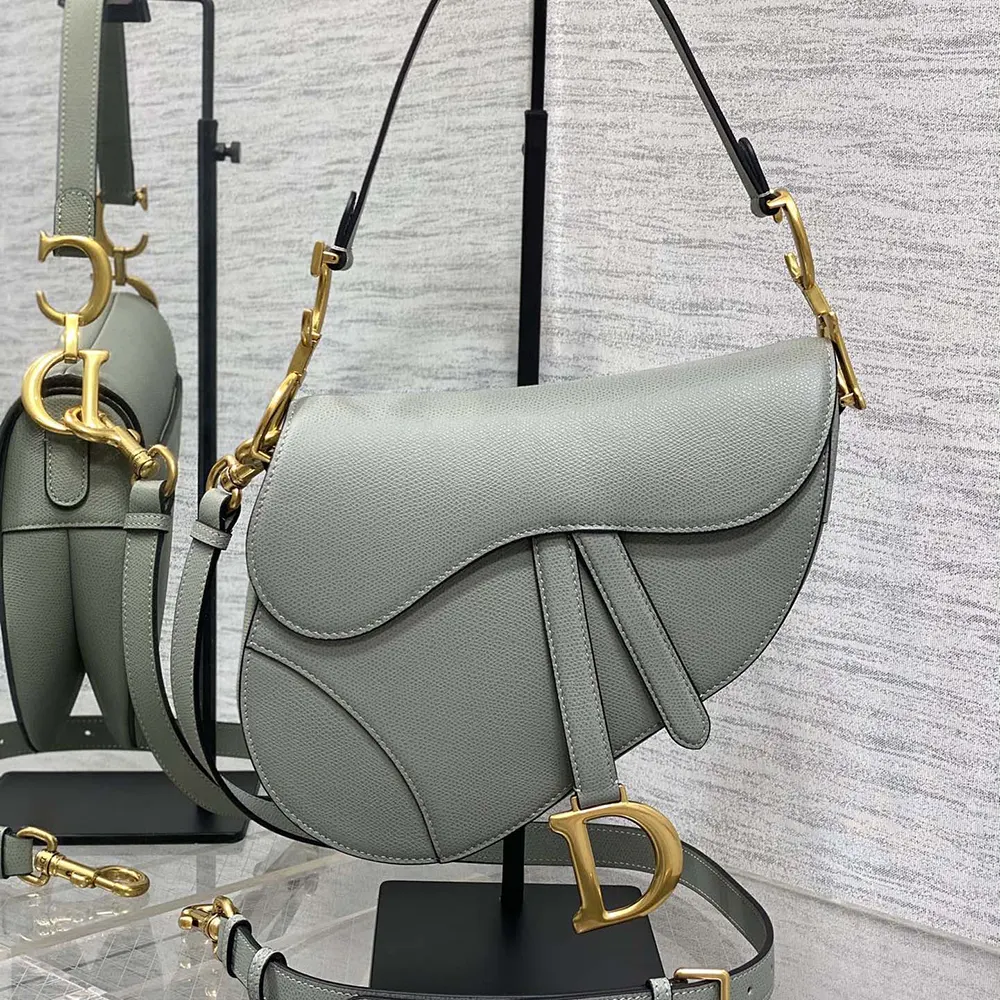 Close-up of flap closure and silver hardware on Dior Women Saddle Bag