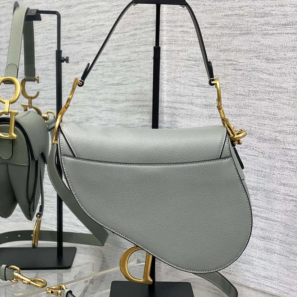 Side angle showing adjustable strap of Dior Women Saddle Bag Stone Gray