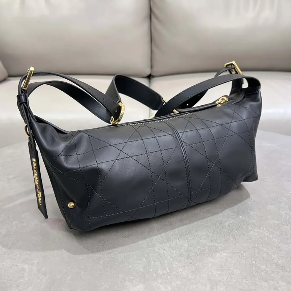 Side angle showing texture and silhouette of Dior Women Small D-Journey Bag