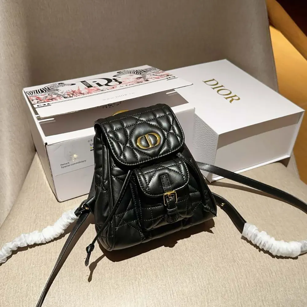 Side angle showing silver-tone hardware on Dior Women Small Caro Backpack