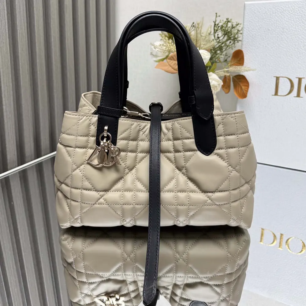 Side angle showing adjustable rope strap on Dior Women Small Dior Toujours Bag