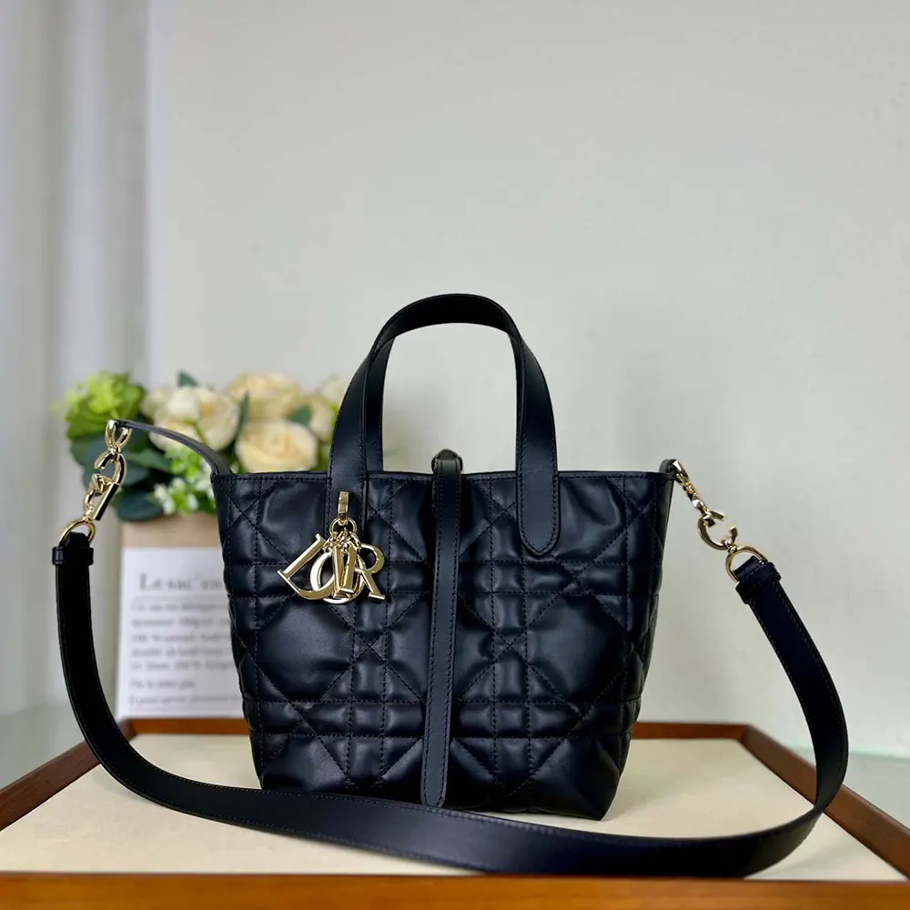 Close-up of black Macrocannage quilted leather on Dior Women Small Dior Toujours Vertical Tote Bag