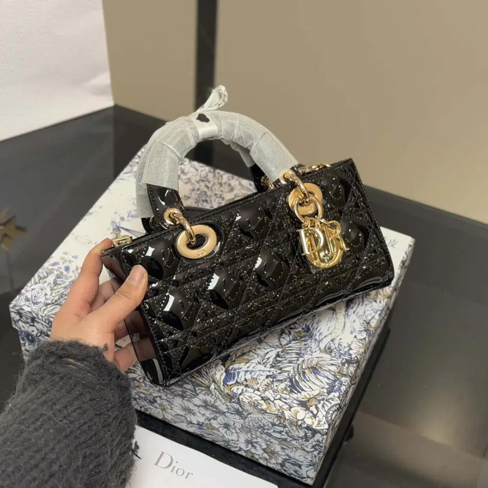 Side profile showing silhouette of Dior Women Small Lady D-Joy Bag Black Patent Cannage
