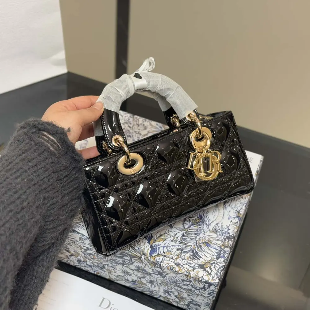 Close-up of gold-tone hardware on Dior Women Small Lady D-Joy Bag