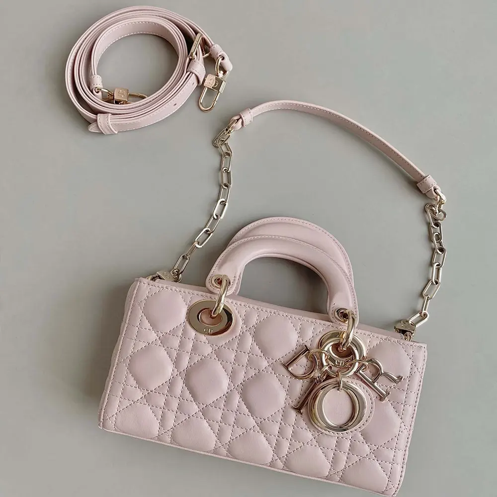 Side angle showing flap closure and silver hardware of Dior Women Small Lady D-Joy Bag