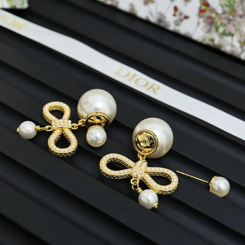 Side angle showing stud closure and double-sided pearls on Dior Women Tribales Earrings