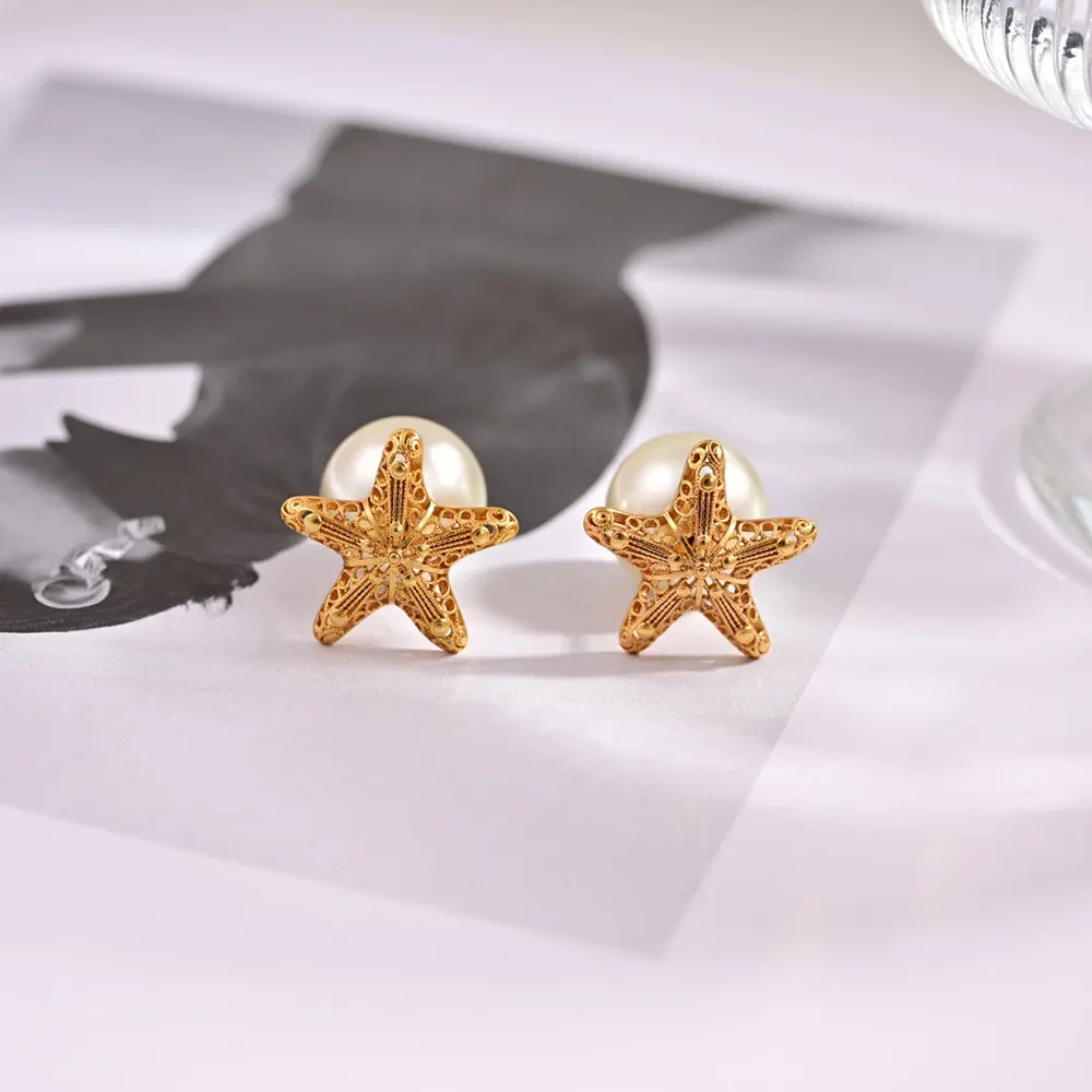 Side angle of Dior Women Tribales Earrings Gold-Finish Metal highlighting contrasting stud sizes