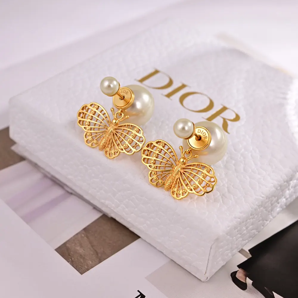 Side angle showing sculptural silhouette of Dior Women Tribales Earrings