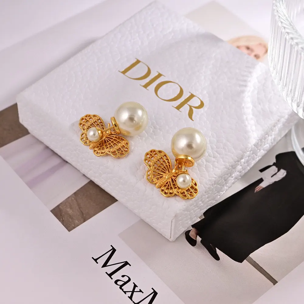 Close-up detail of white resin pearls on Dior Women Tribales Earrings