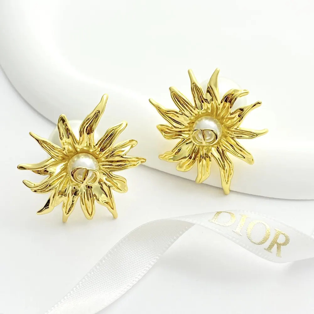 Side angle showing white resin pearls on Dior Women Tribales Earrings
