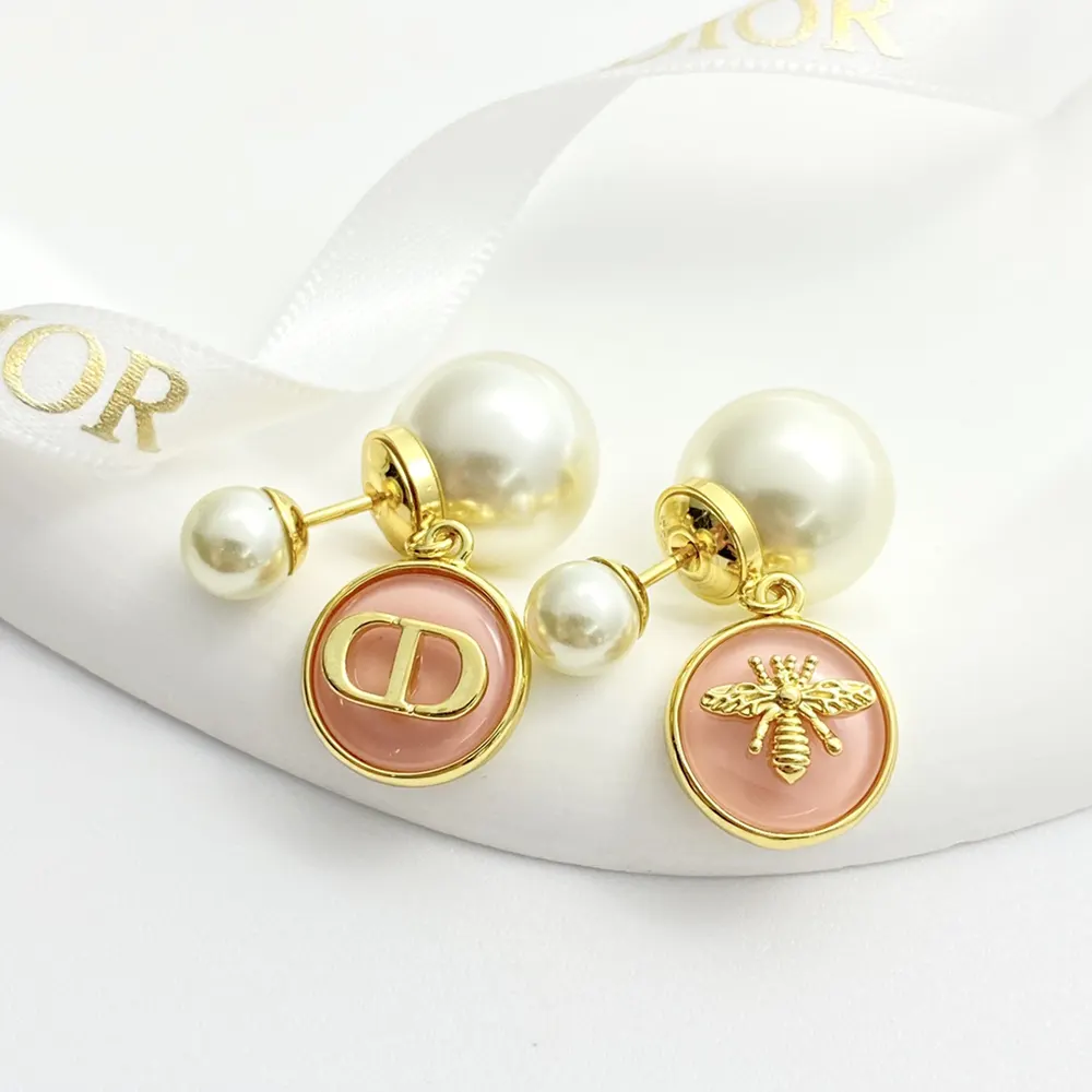 Close-up of pink transparent resin detail on Dior Women Tribales Earrings