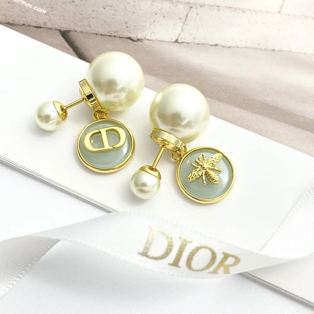 Close-up detail of pistachio green resin on Dior Women Tribales Earrings