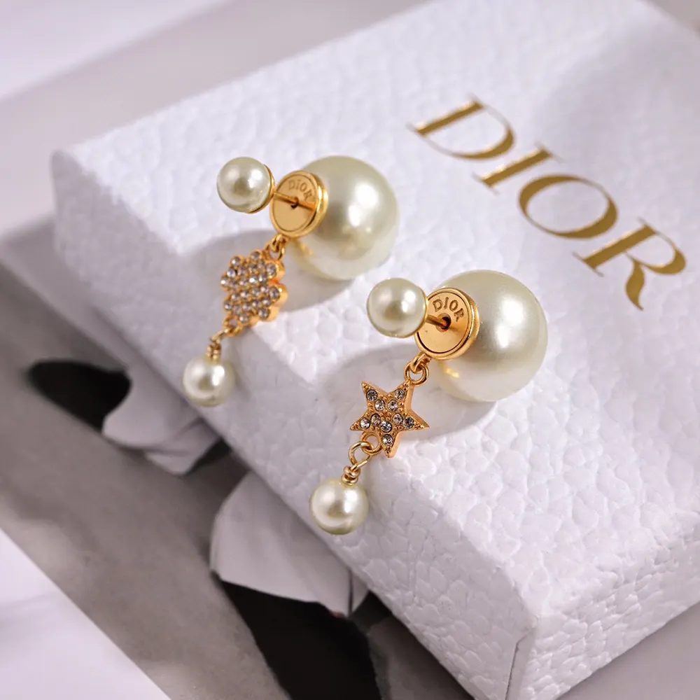 Close-up on white resin pearl detail of Dior Women Tribales Earrings