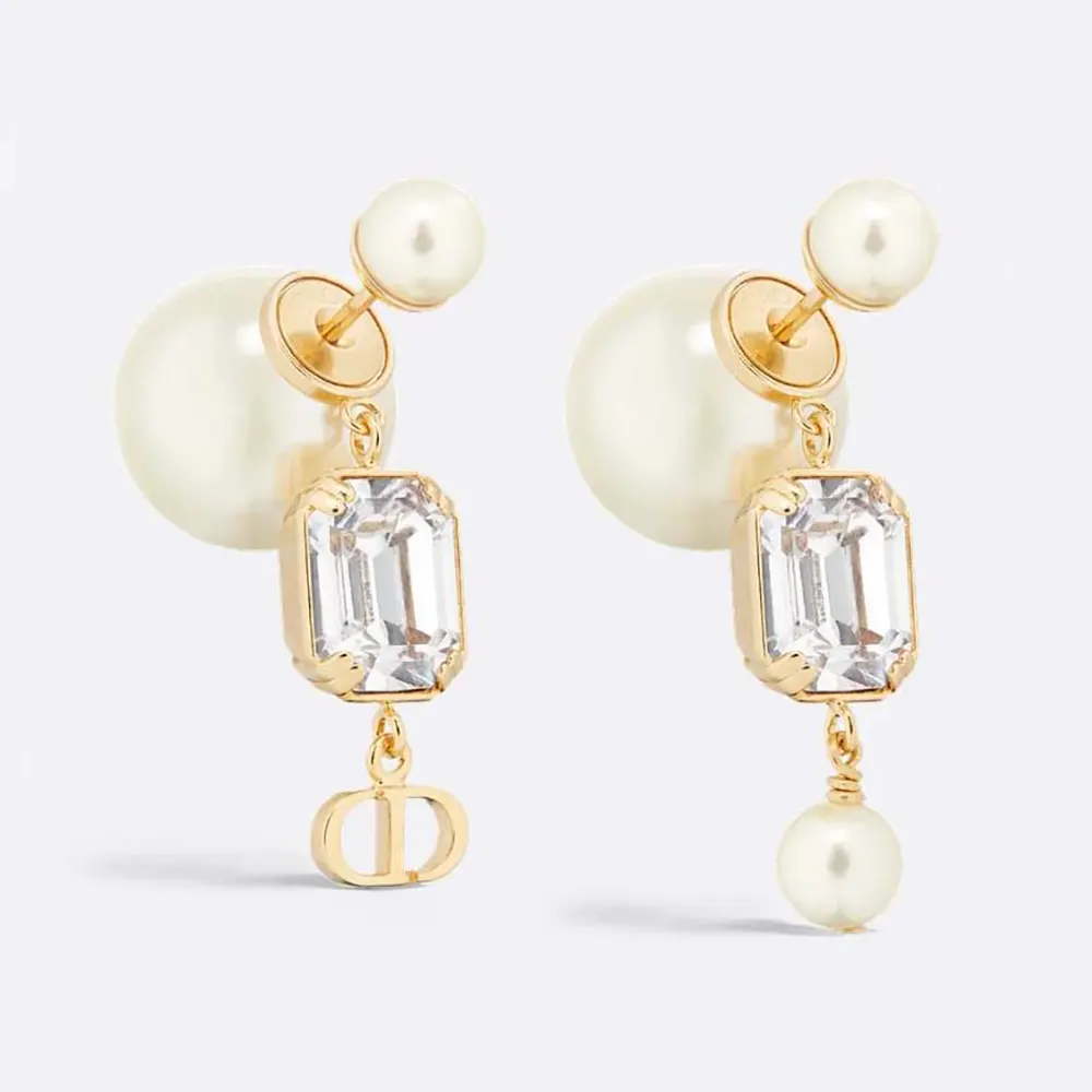 Close-up of Dior Women Tribales Earrings showing gold-finish metal and white resin pearls