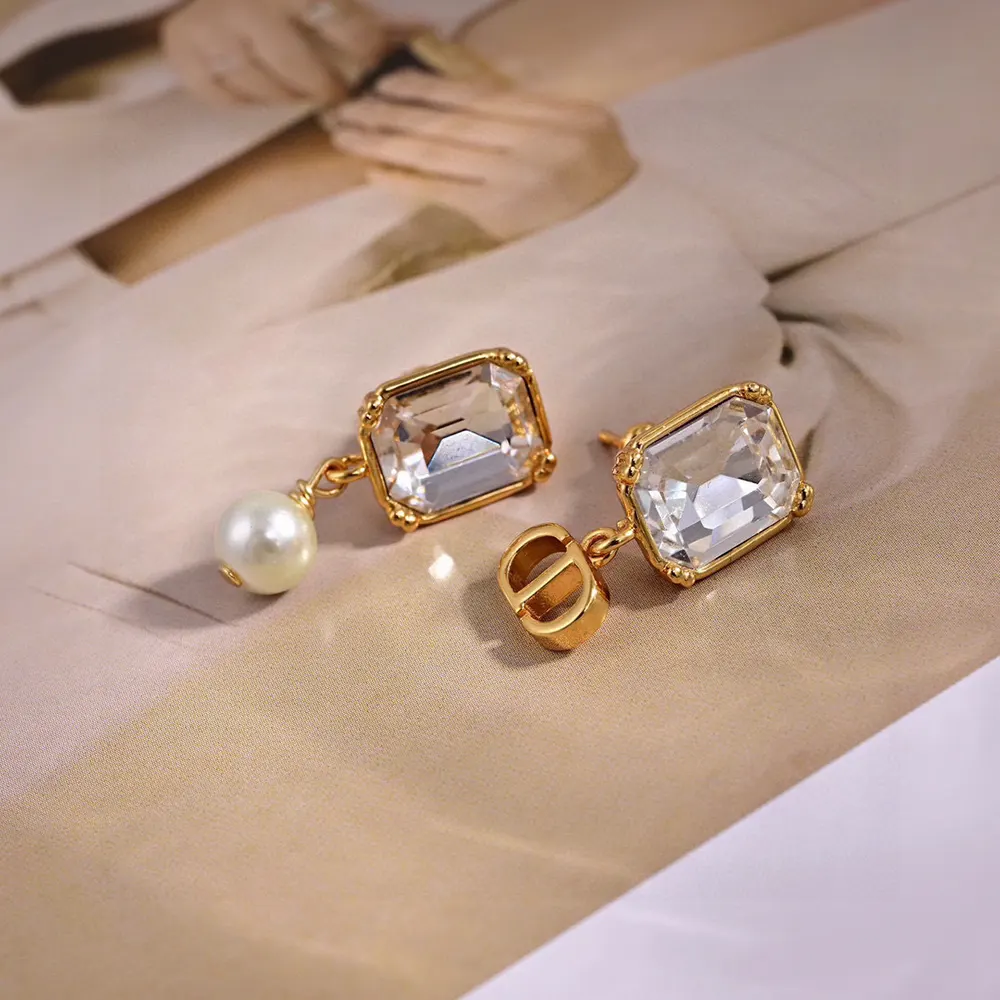 Side view of Dior Women Tribales Earrings highlighting silver-tone crystal accents