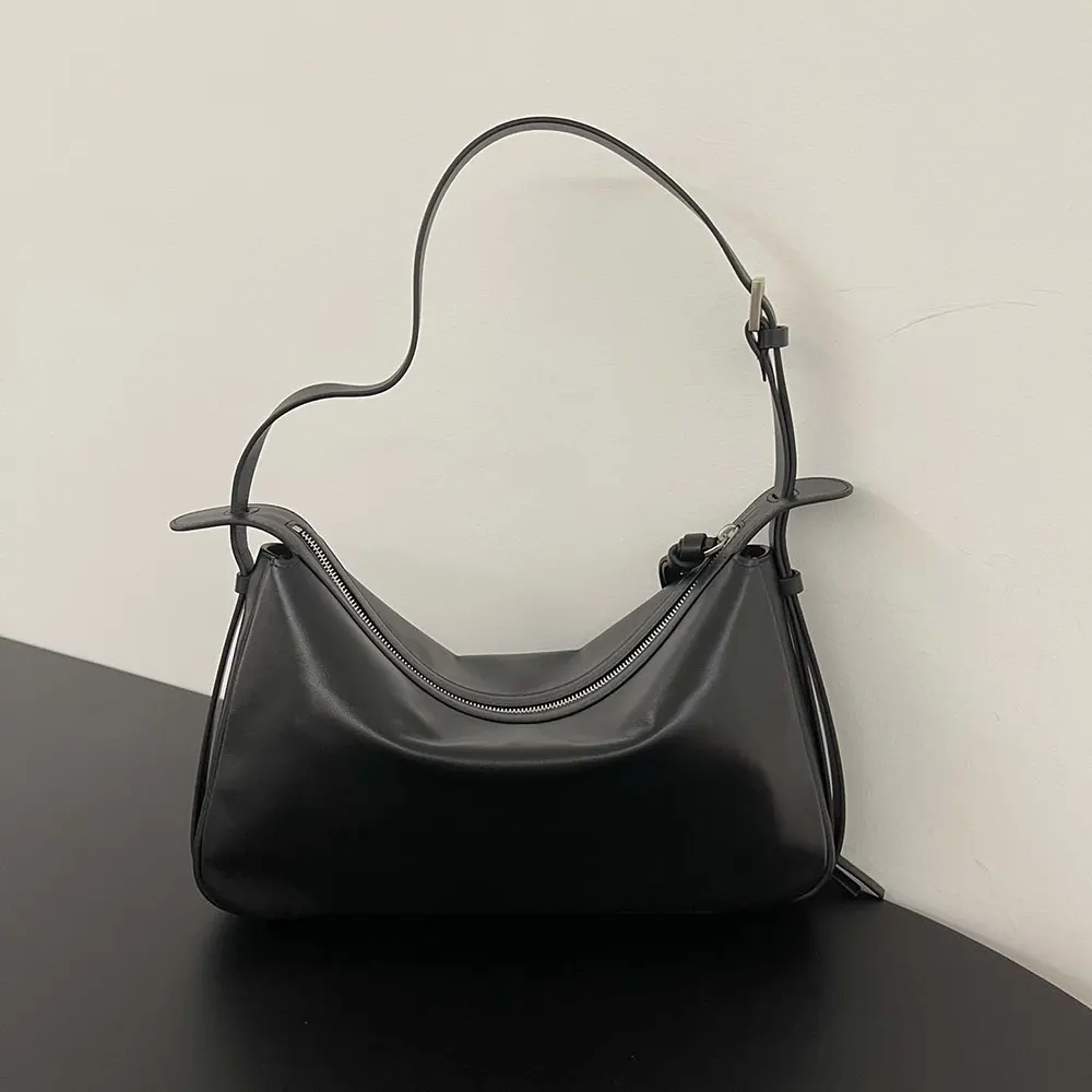 Side profile showing adjustable strap of Fendi Simply Fendi black bag