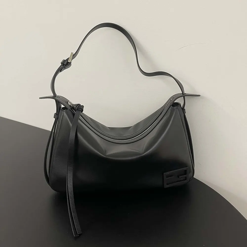 Close-up of gold hardware on Fendi Simply Fendi medium leather bag