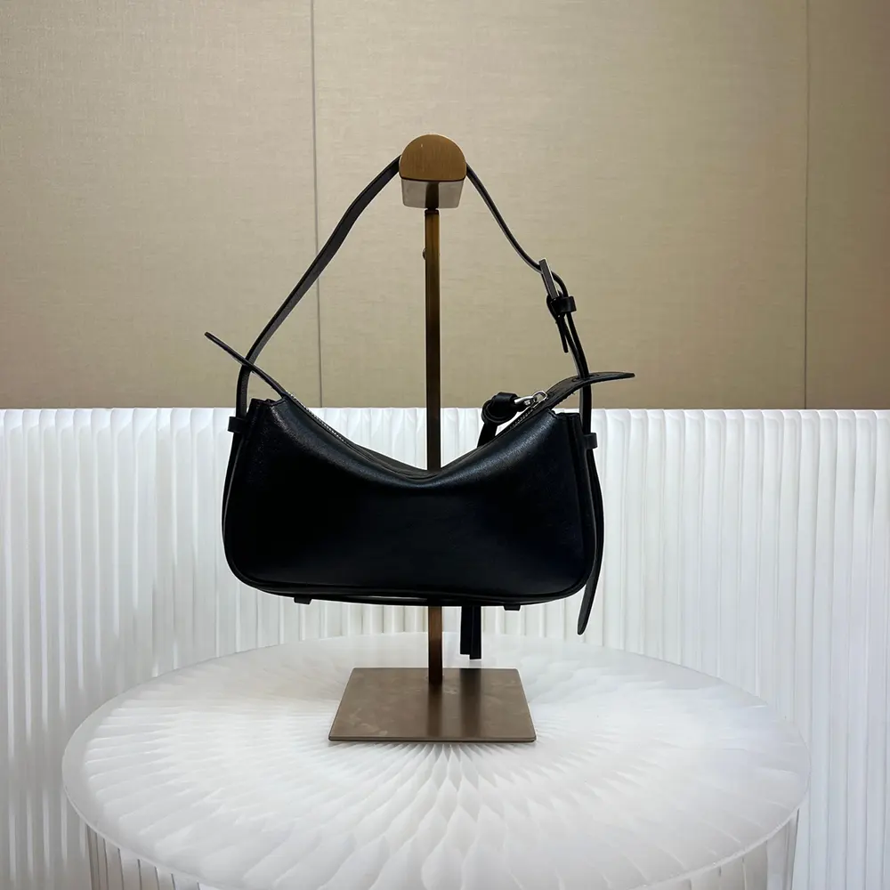Side profile showing silhouette of Fendi Unisex Simply Fendi Mini Black Leather Mini-bag