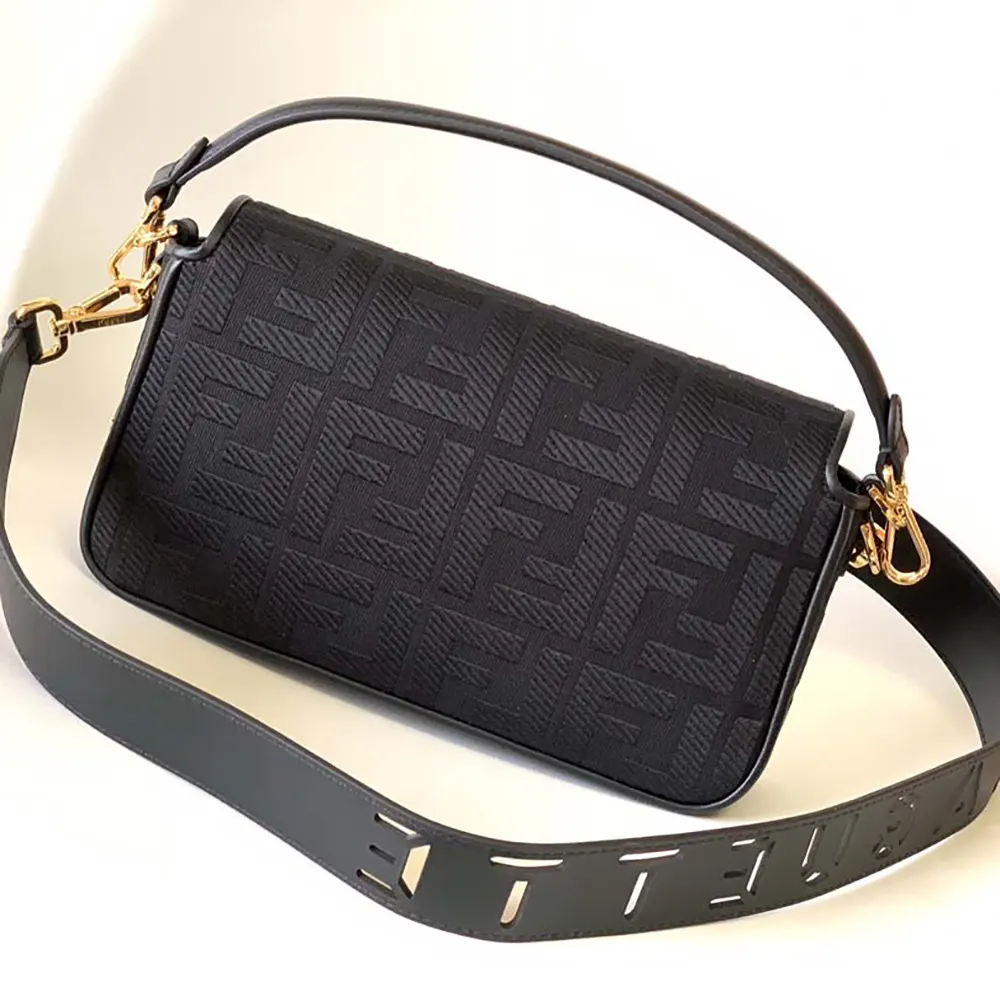 Side angle showing silver hardware on Fendi Women Baguette Black Denim Bag