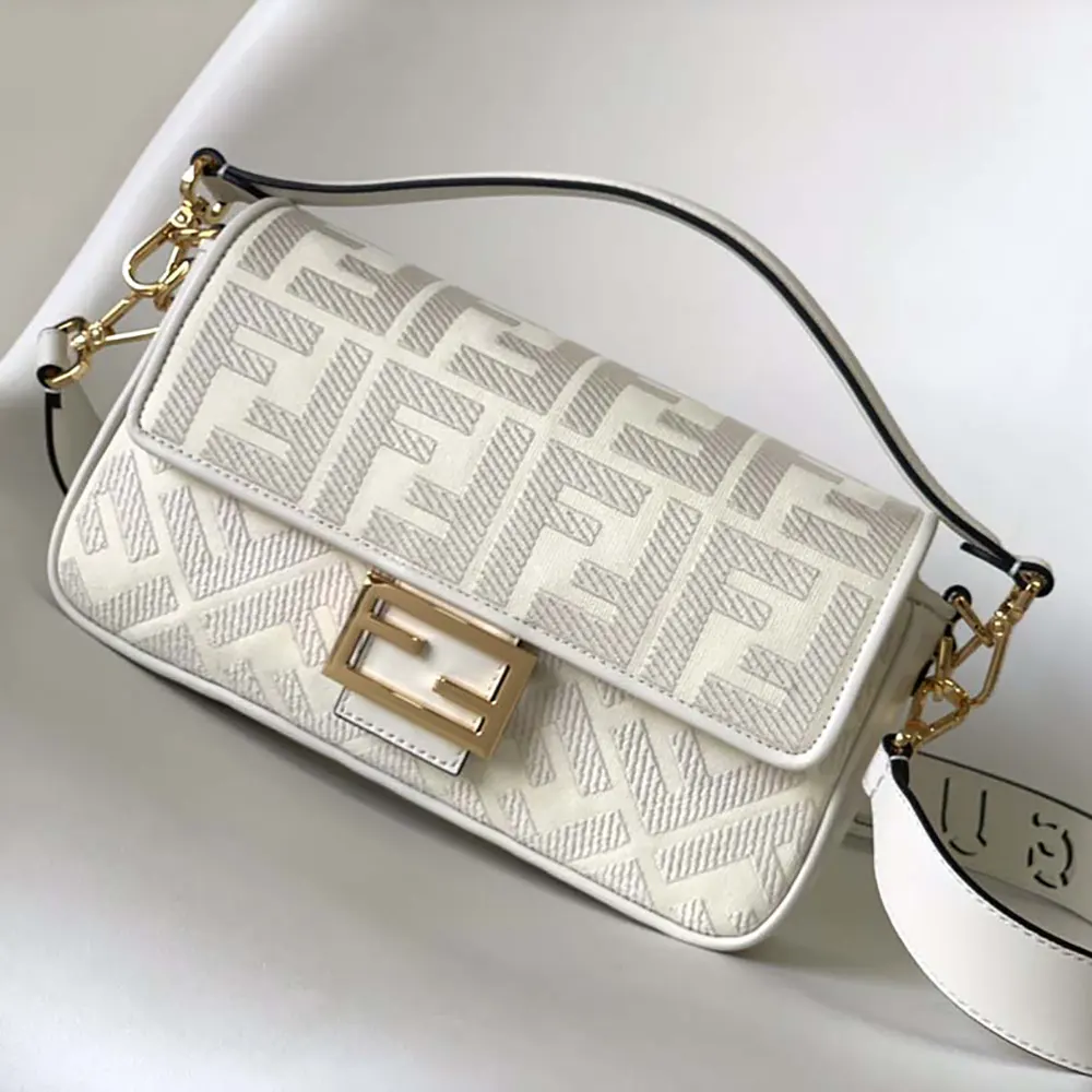Close-up of FF embroidery detail on white denim Fendi bag