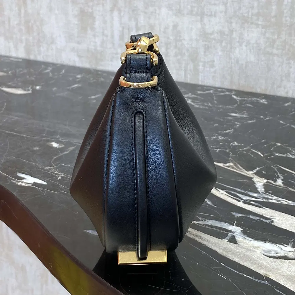 Side angle showing adjustable strap of Fendi black leather mini-bag