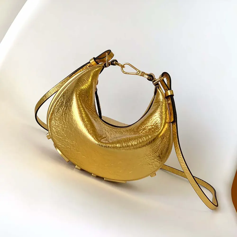 Close-up of luxurious gold leather and Fendigraphy print detail