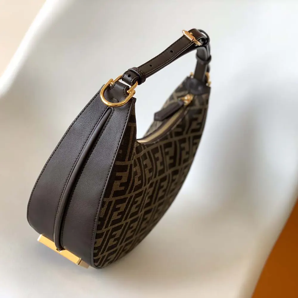 Side profile showing gold-tone hardware on Fendi Fendigraphy small bag