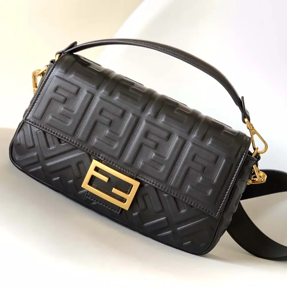 Close-up of gold-tone hardware on Fendi Women Medium Baguette Black Leather Bag