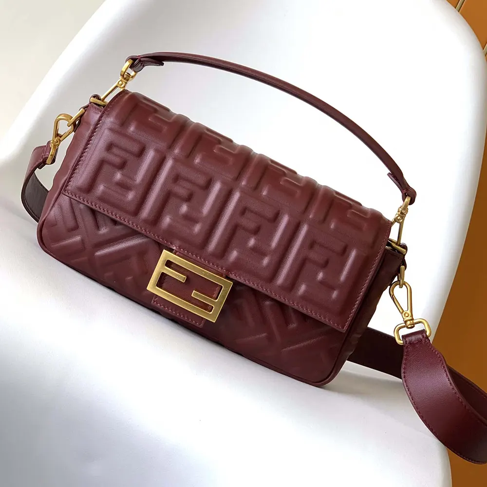 Close-up on signature clasp of Fendi Women Medium Baguette Maroon Leather Bag