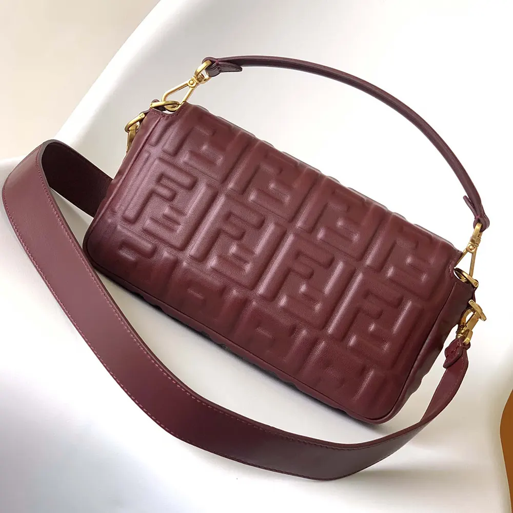 Side angle showing adjustable strap of Fendi Women Medium Baguette Maroon Leather Bag