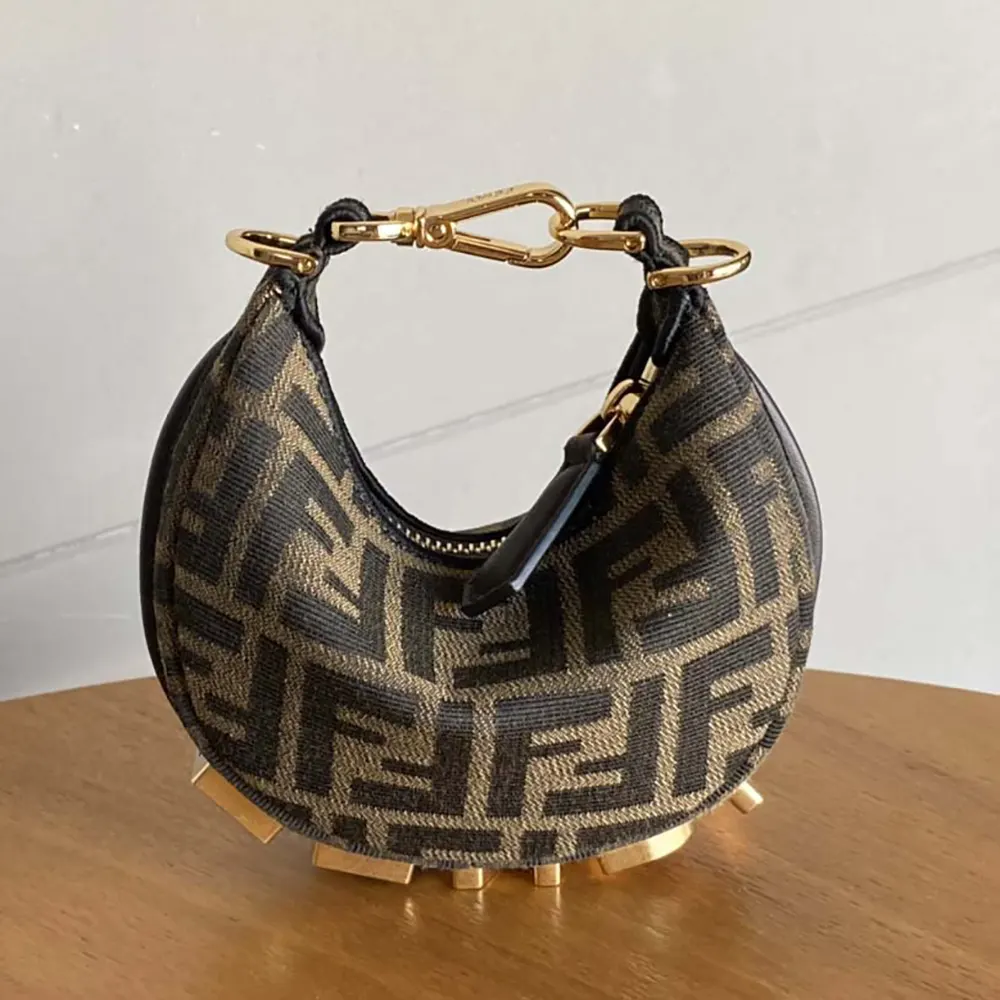 Side profile showing slim silhouette of Fendi Women Nano Fendigraphy Charm