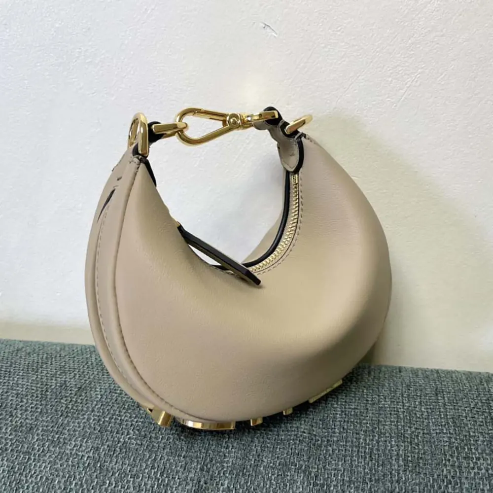 Side profile showing slim silhouette of Fendi Women Nano Fendigraphy Gray Leather Charm