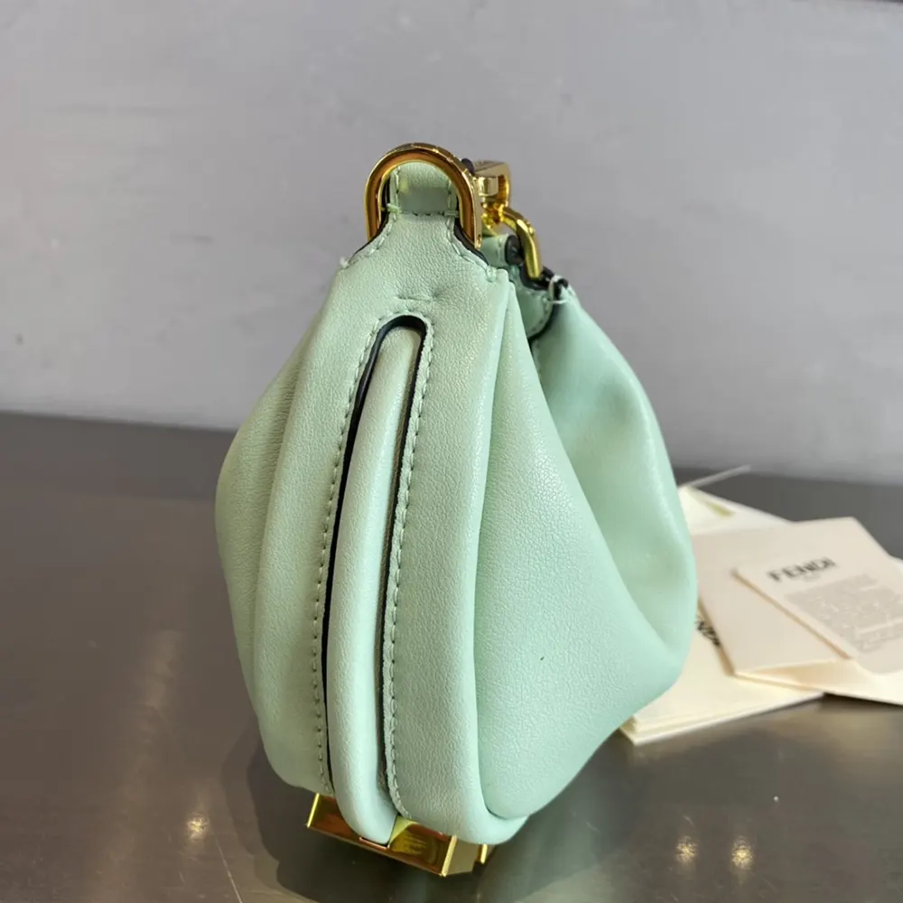Side angle showcasing compact silhouette of Fendi Women Nano Fendigraphy Lime Charm