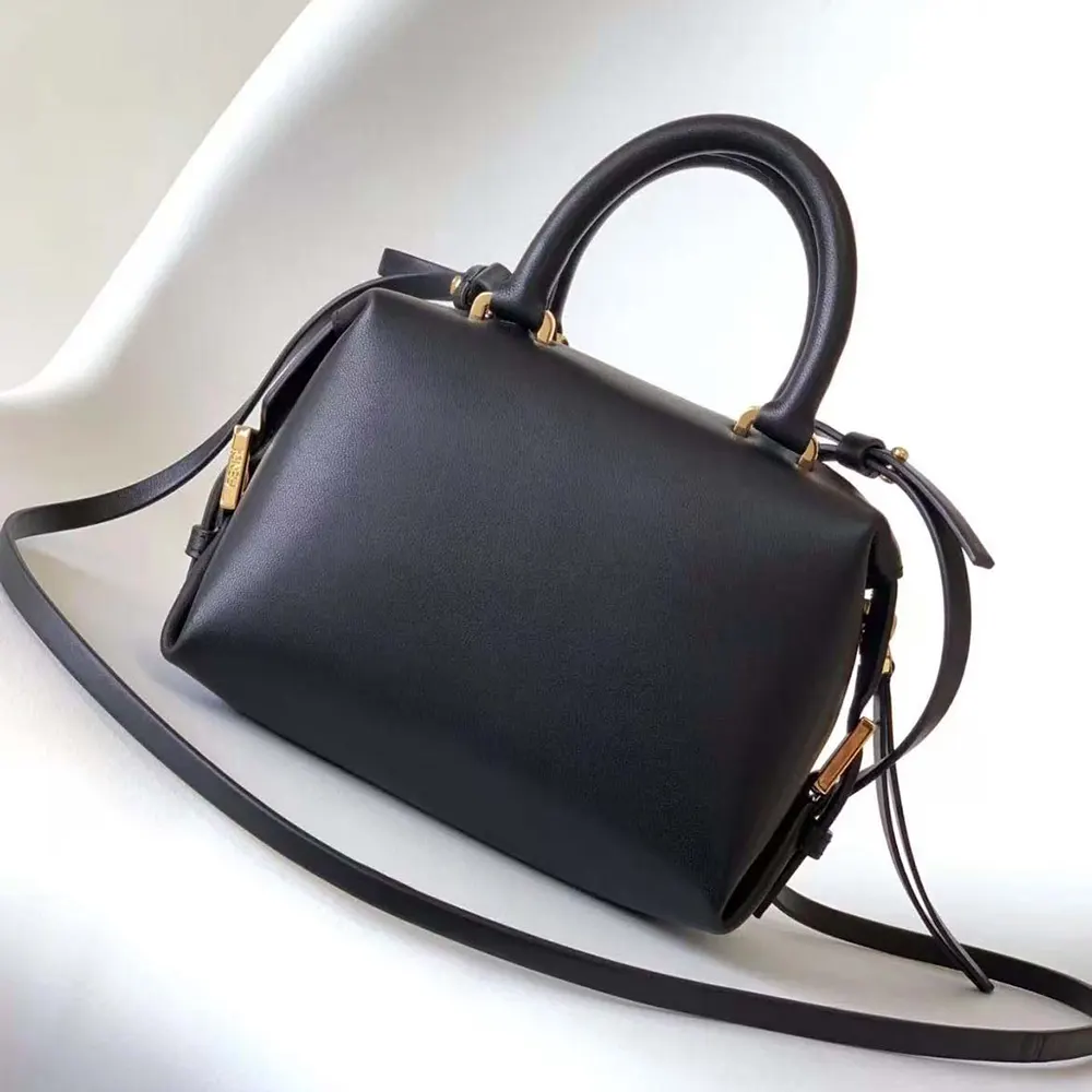 Side angle of Fendi Women Nappa FF Mini Cube Bag-Black with adjustable strap visible
