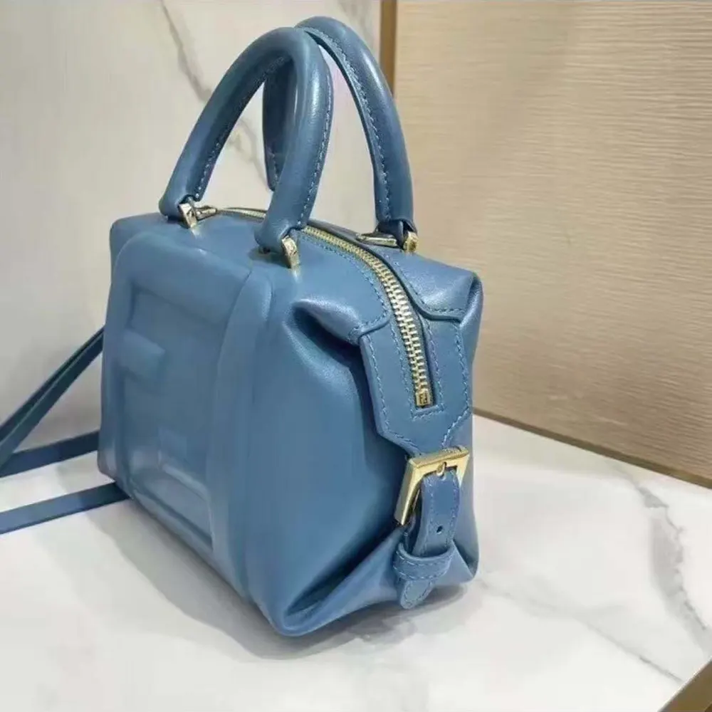 Side profile of Fendi Women Nappa FF Mini Cube Bag-Blue with shoulder strap