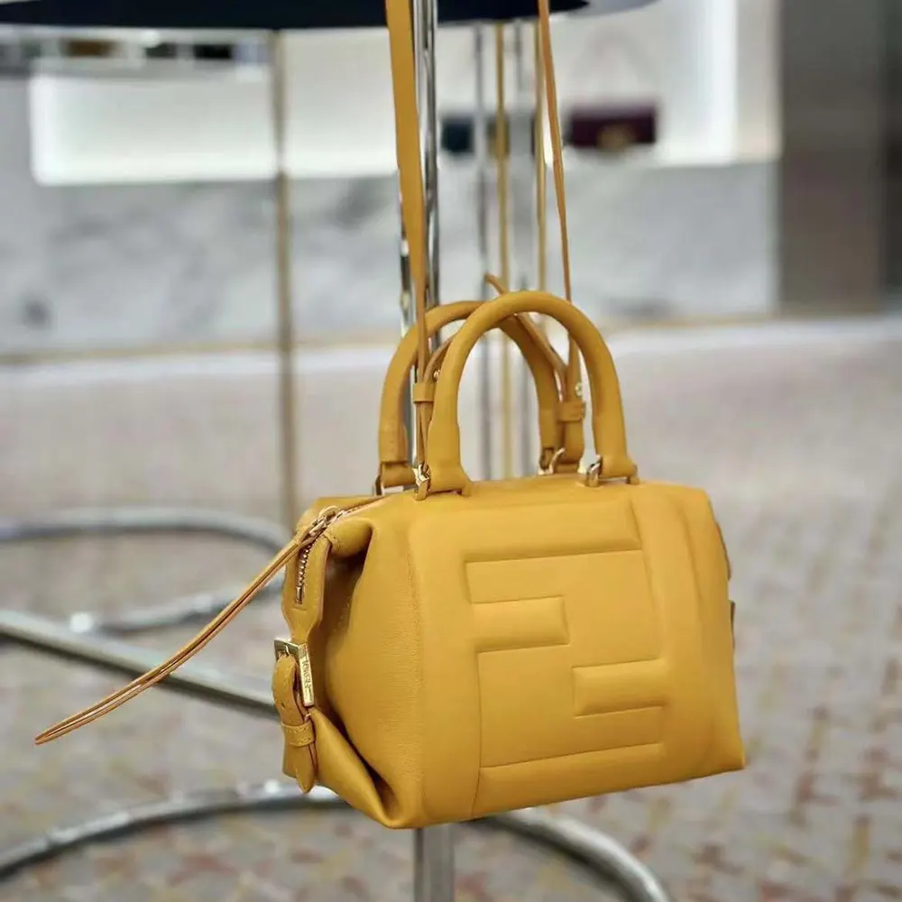 Side angle of compact silhouette on Fendi Women Nappa FF Mini Cube Bag-Orange