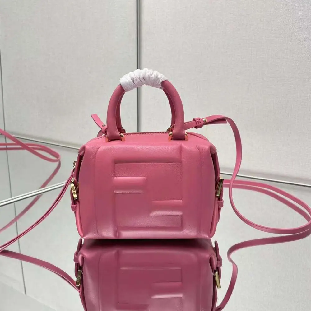 Close-up of gold-tone FF logo hardware on Fendi Mini Cube Bag-Pink
