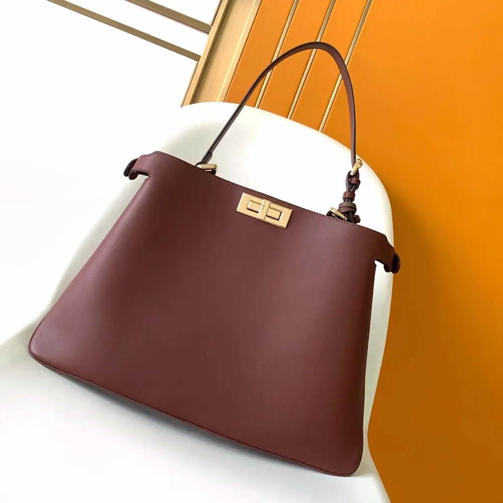 Close-up of gold-tone hardware on Fendi Peekaboo Soft Large Dark Brown Bag
