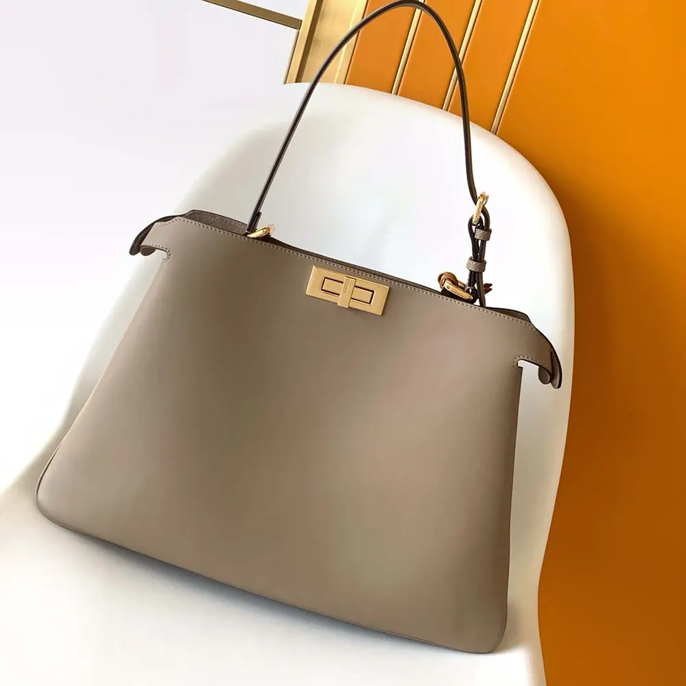 Close-up of gold-tone twist-lock on Fendi Women Peekaboo Soft Large Dove gray Leather Bag