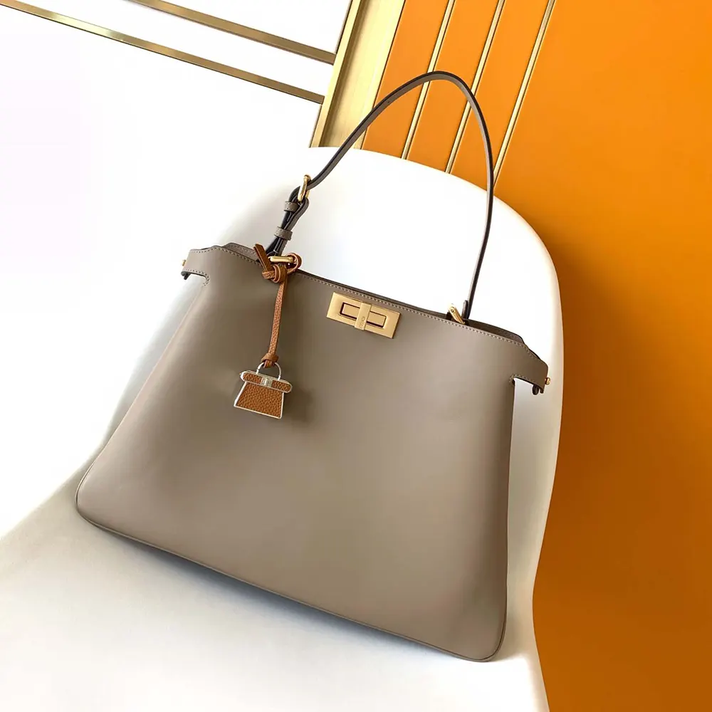 Side profile showing supple leather texture on Fendi Women Peekaboo Soft Large Dove gray Leather Bag