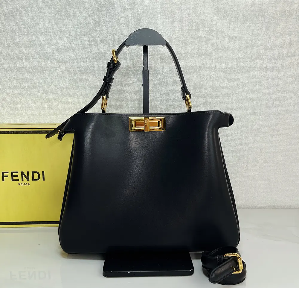 Close-up of gold-tone hardware and twist-lock on the Fendi Peekaboo Soft bag