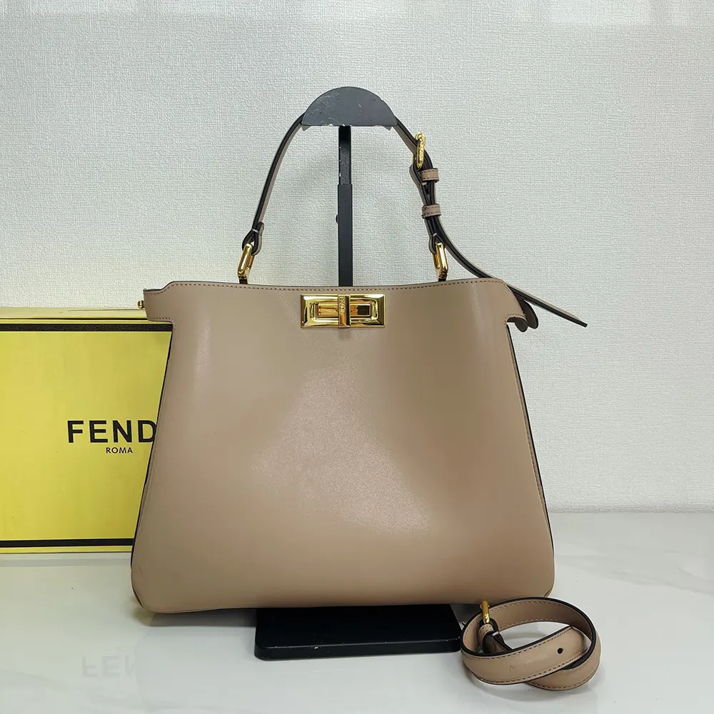 Close-up of gold-tone hardware on Fendi Women Peekaboo Soft Medium Dove Gray Leather Bag