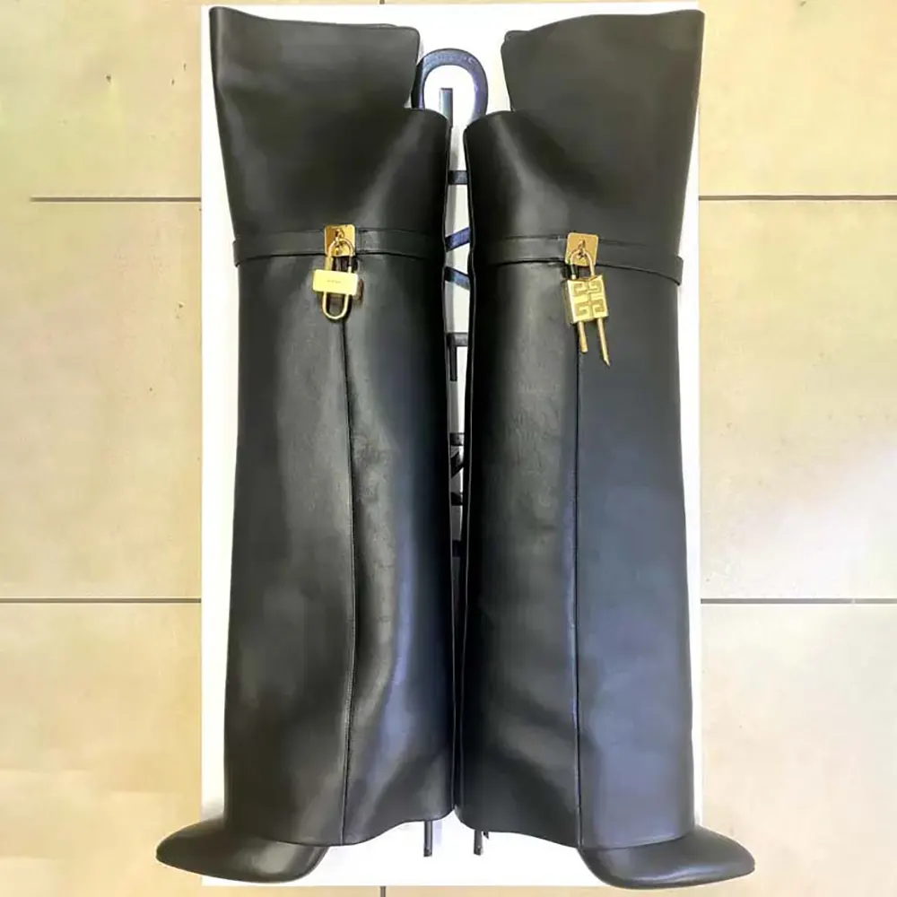 Rear angle showing stiletto heel and silhouette of Givenchy Shark Lock Over-the-knee Boots