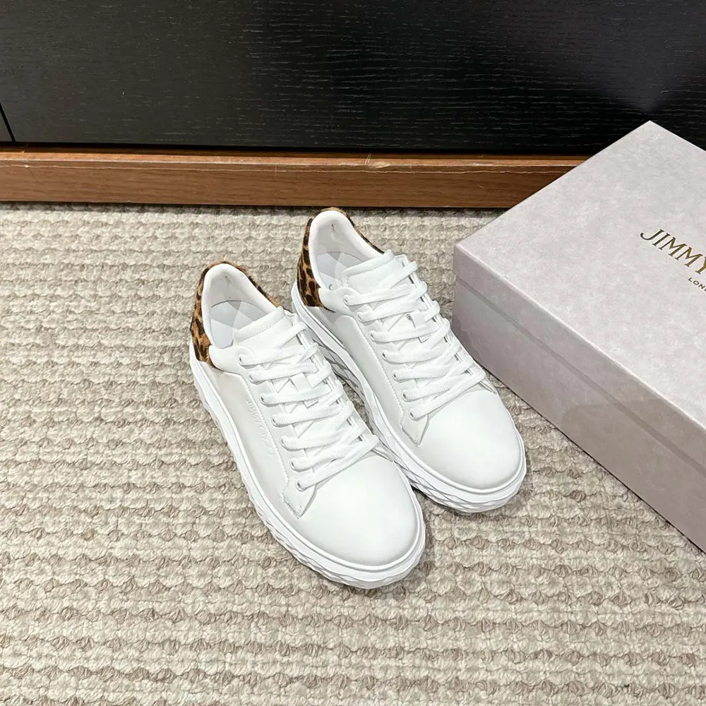Close-up of white leather and leopard print detail on Jimmy Choo trainers