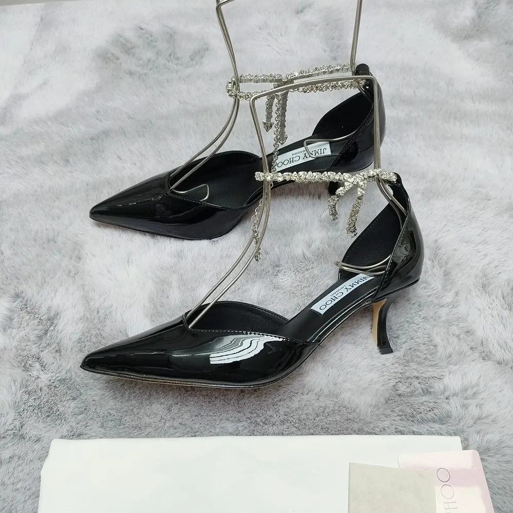 Elegant front angle showing pointed toe of Jimmy Choo Stevie 50 pumps