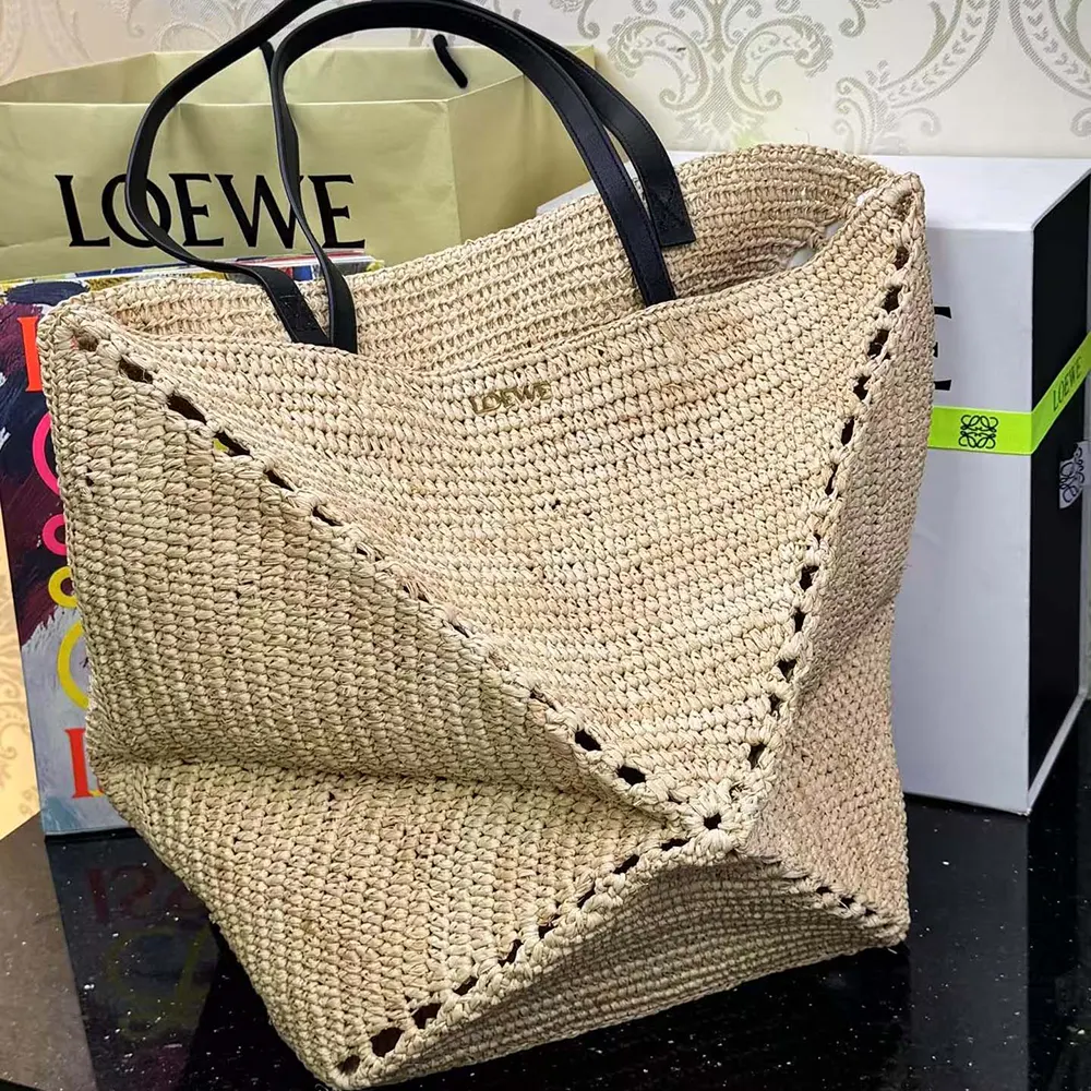 Side angle showing fold and leather trim detail on Loewe XL Puzzle Tote