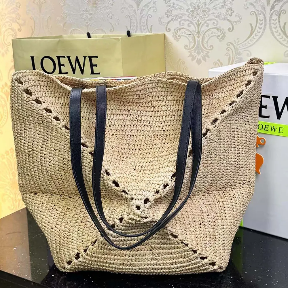Close-up of raffia texture and signature puzzle pattern on Loewe tote