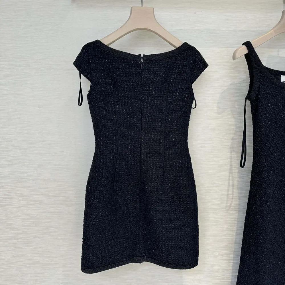 Side angle showcasing tailored silhouette of Miu Miu Women Lamé Bouclé Dress