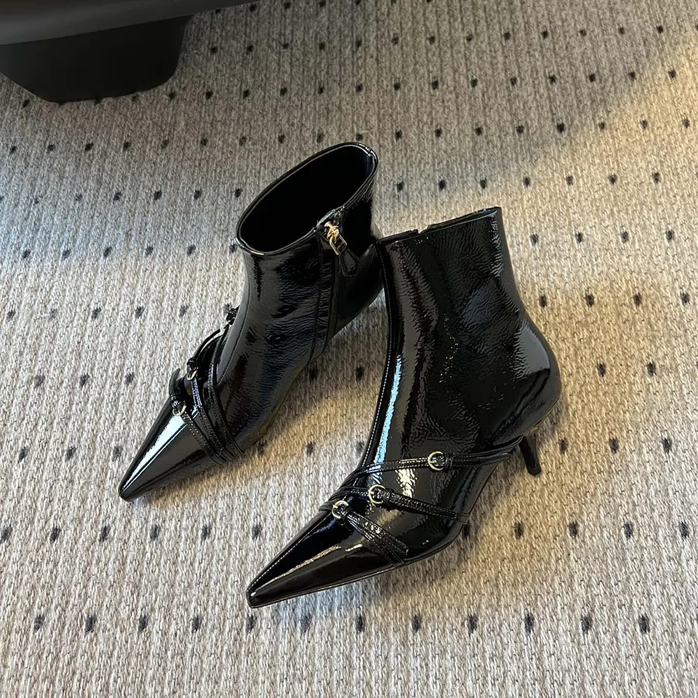 Front view displaying sleek silhouette of Miu Miu Women Naplak Booties-Black