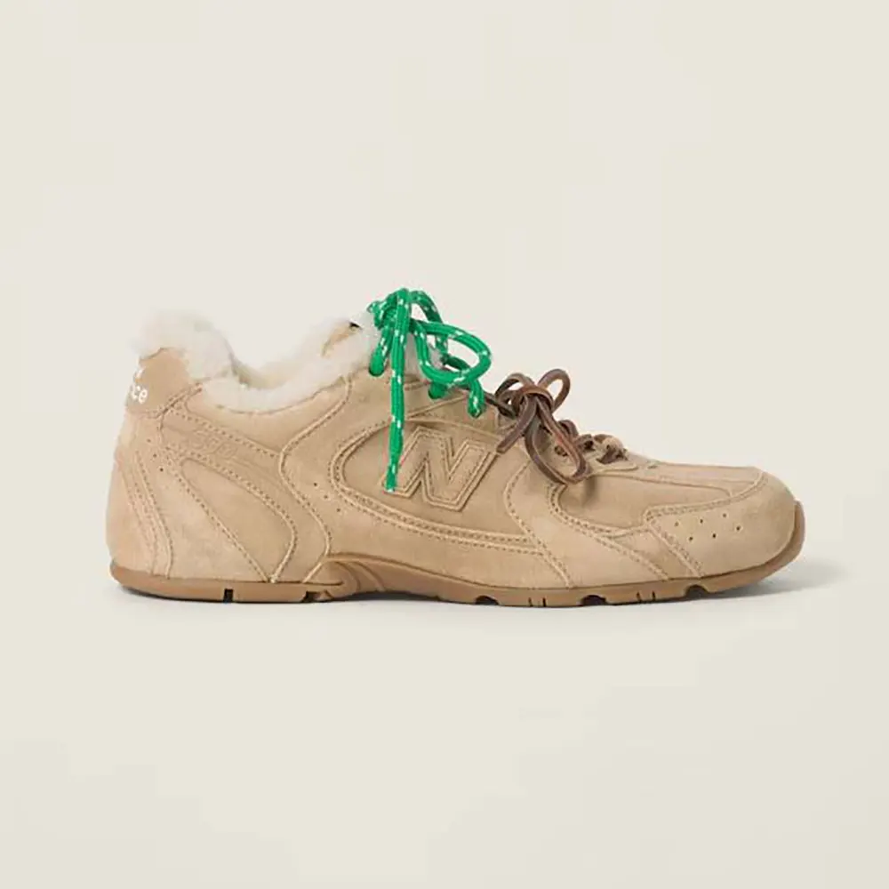 Side view of Miu Miu Women New Balance X Miu Miu 530 SL Bleached Leather Sneakers